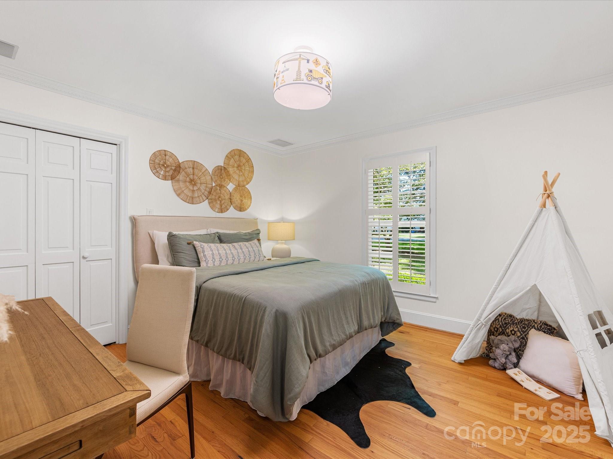 2118 Sharon Road Charlotte, NC 28207 - Photo 26 of 48 a bedroom with a bed and window