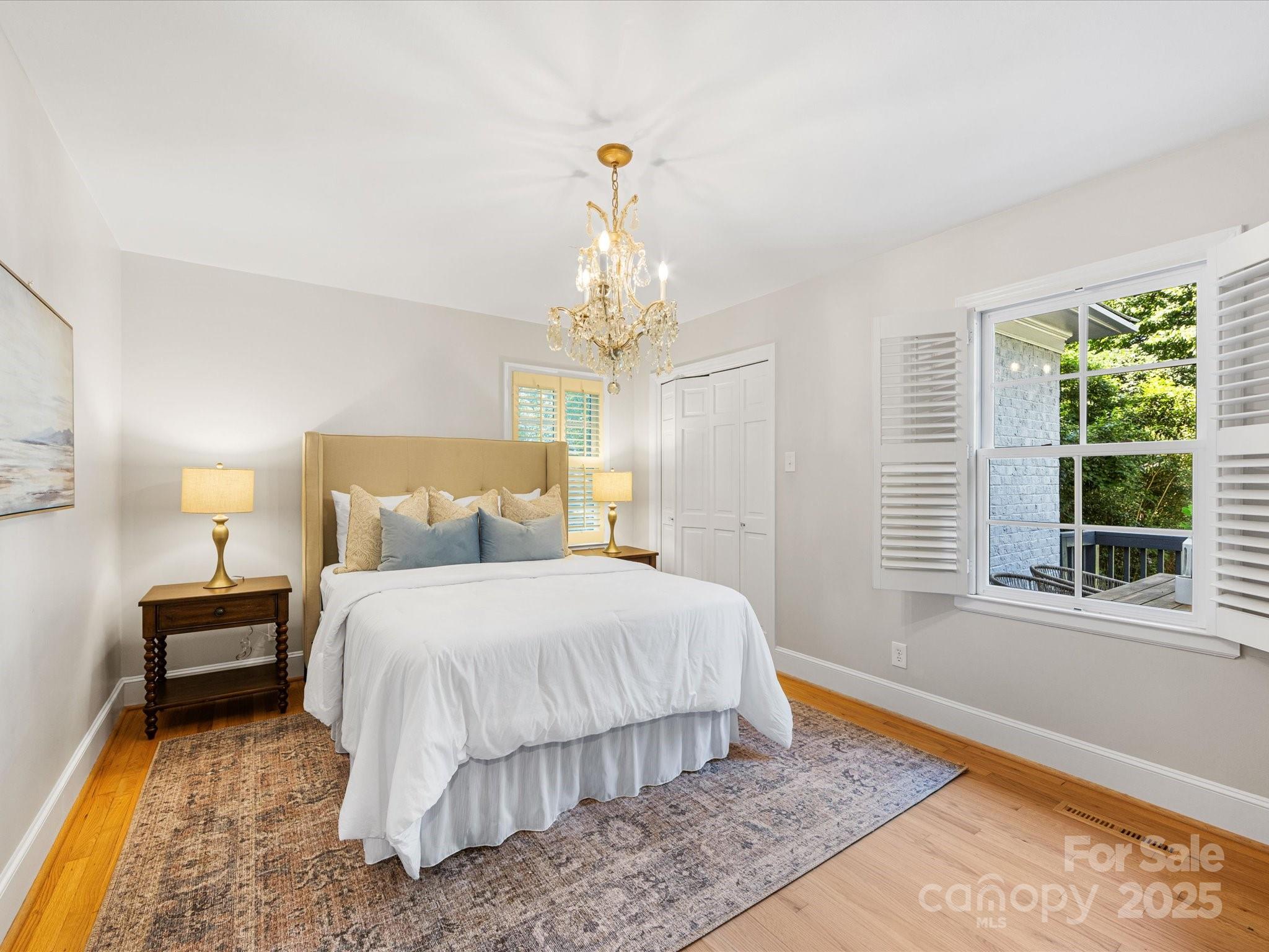 2118 Sharon Road Charlotte, NC 28207 - Photo 28 of 48 a bedroom with a bed and a window