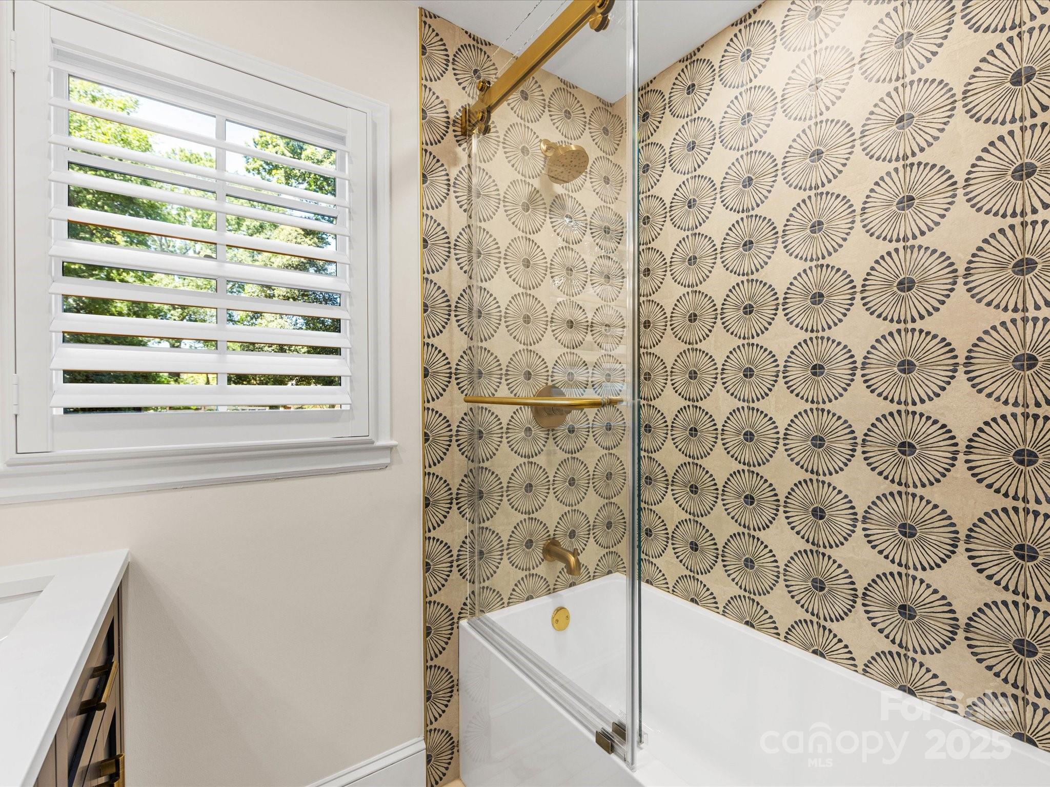 2118 Sharon Road Charlotte, NC 28207 - Photo 30 of 48 a bathroom with a bathtub and shower