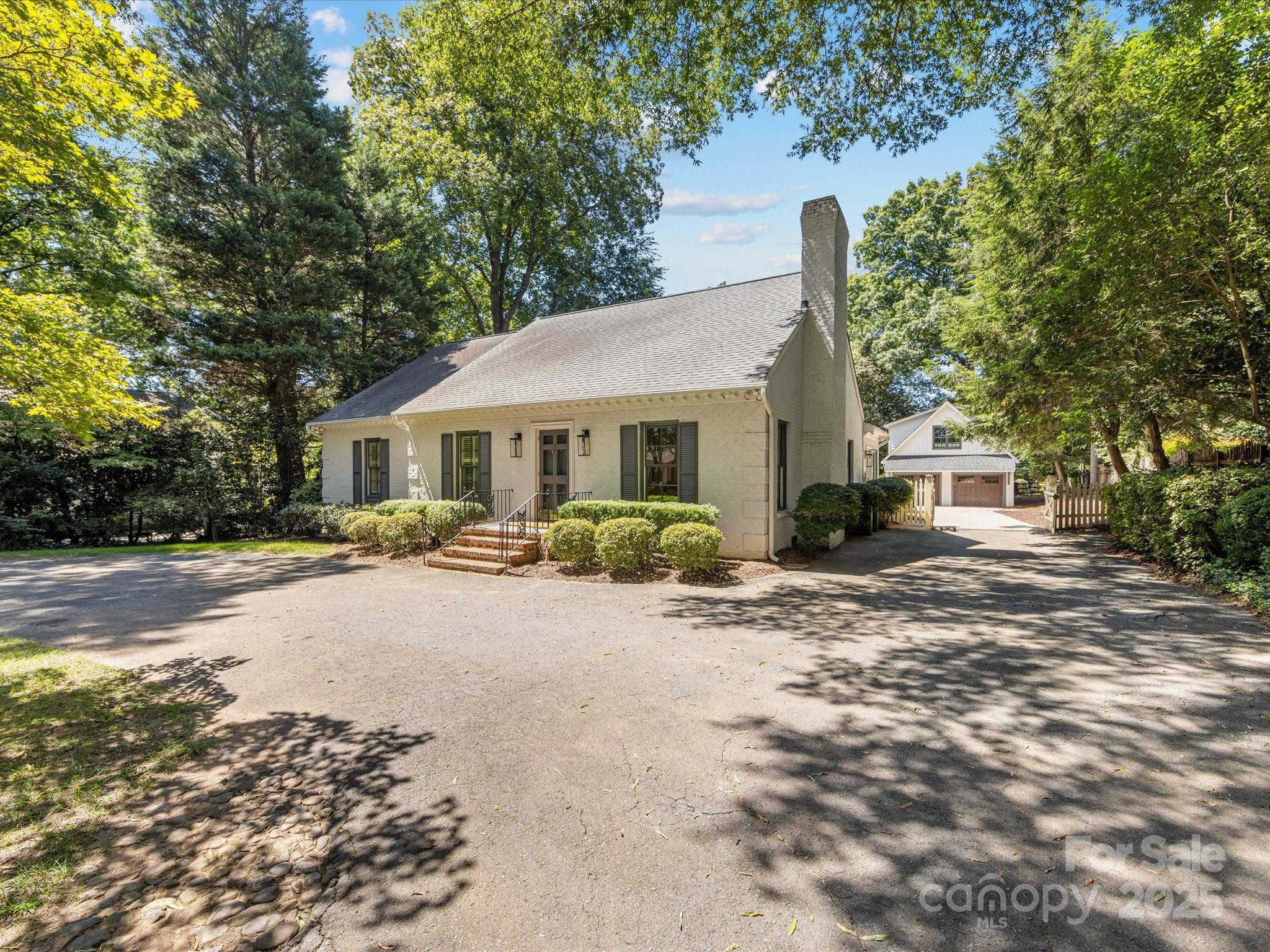 2118 Sharon Road Charlotte, NC 28207 - Photo 3 of 48 a view of a house with backyard and a tree