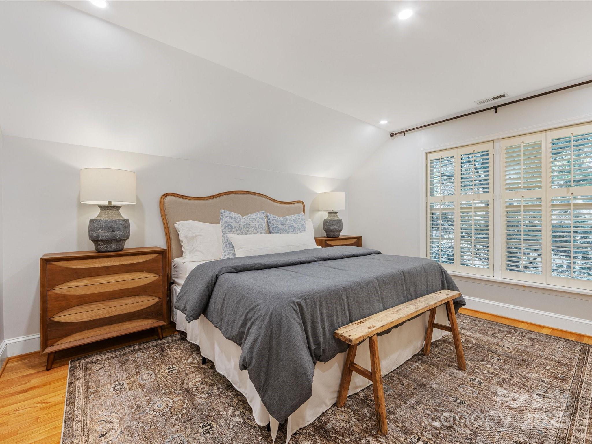 2118 Sharon Road Charlotte, NC 28207 - Photo 35 of 48 a bedroom with a bed and a large window