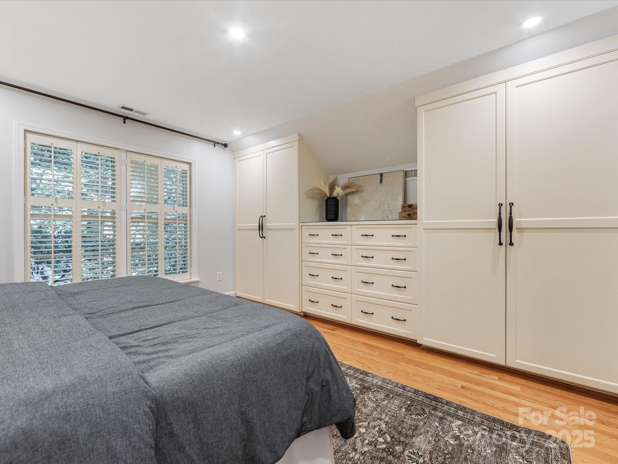 2118 Sharon Road Charlotte, NC 28207 - Photo 36 of 48 a bed room with a bed and a window