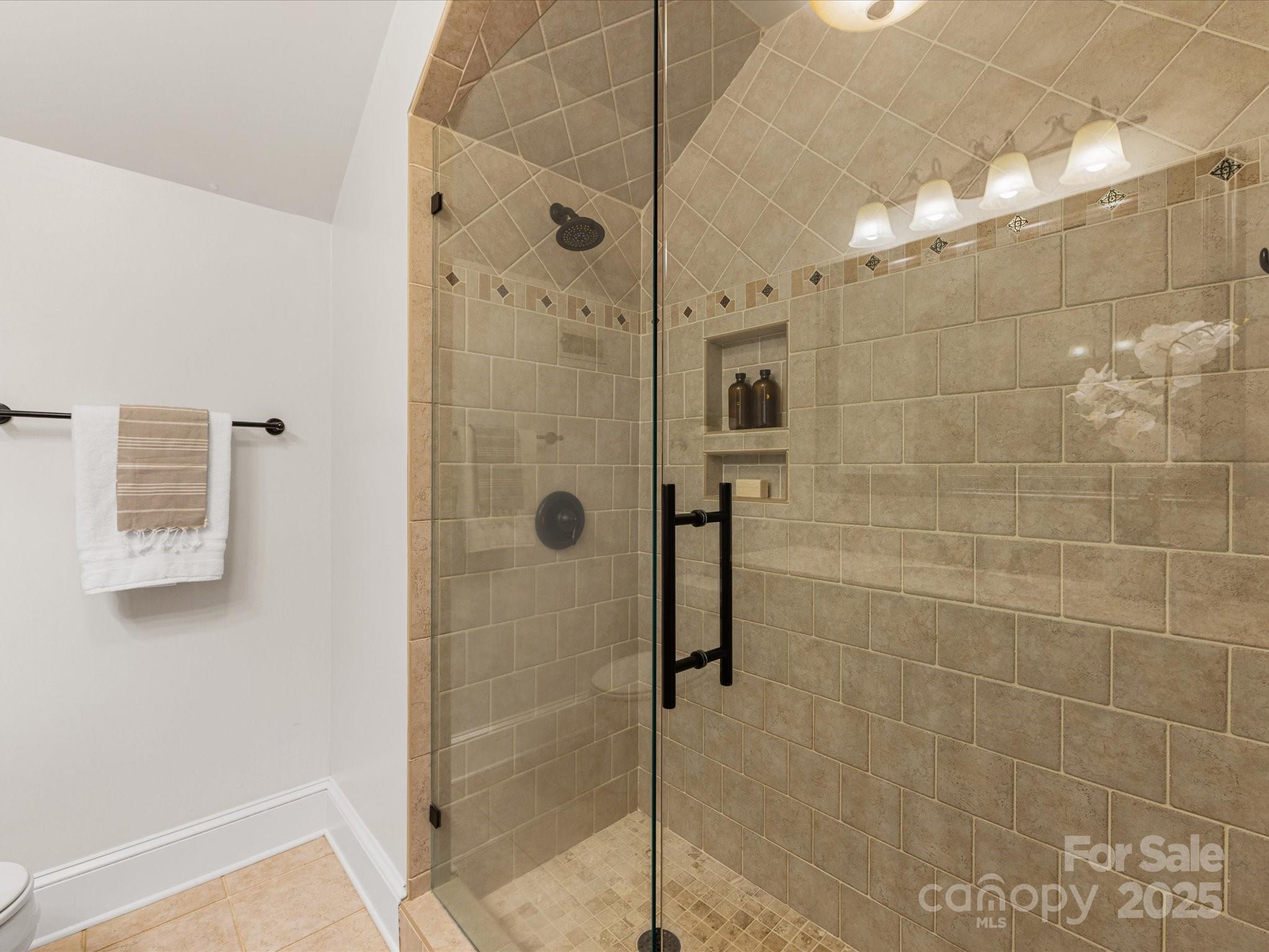 2118 Sharon Road Charlotte, NC 28207 - Photo 38 of 48 a bathroom with a shower