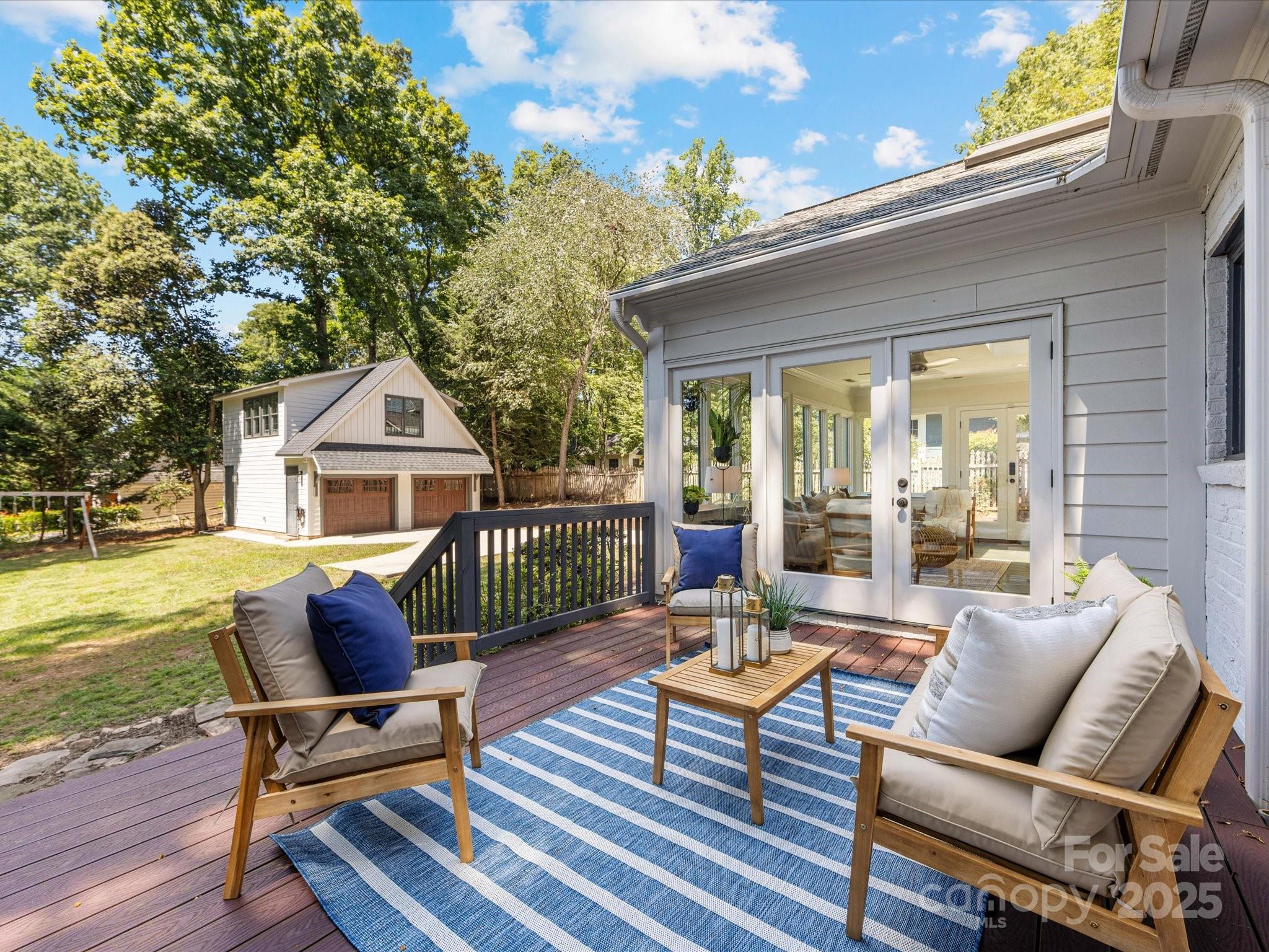2118 Sharon Road Charlotte, NC 28207 - Photo 44 of 48 a outdoor space with patio the couches and a dining table with garden view