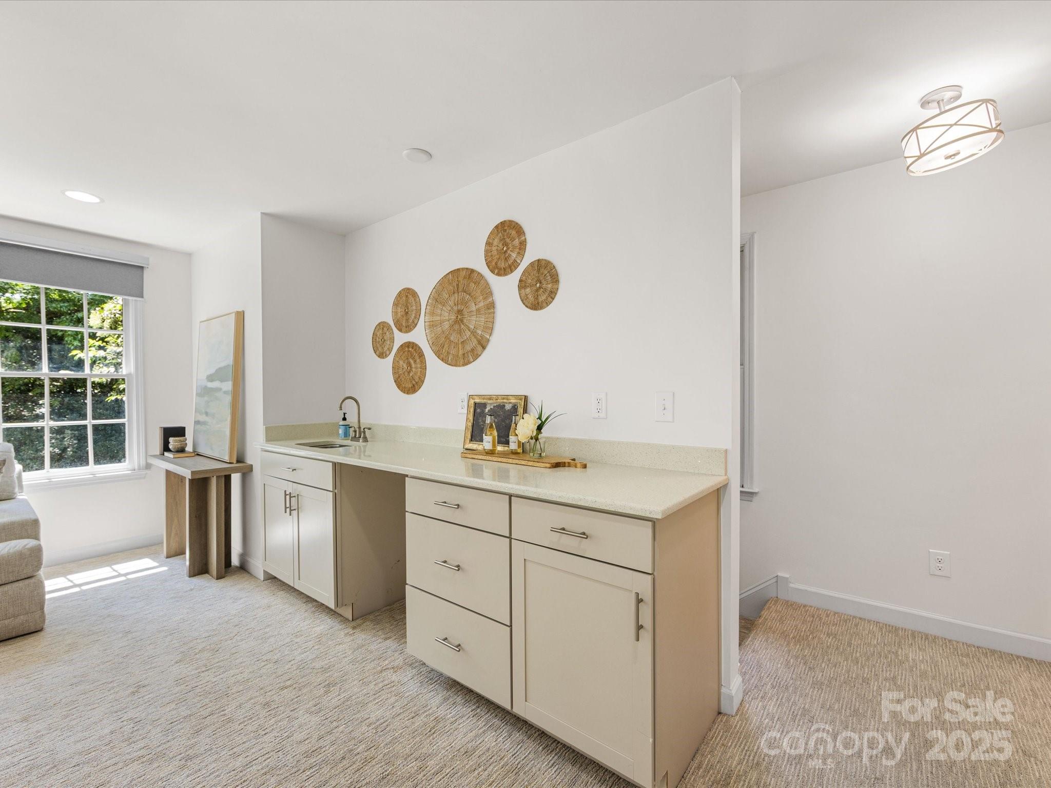 2118 Sharon Road Charlotte, NC 28207 - Photo 45 of 48 a room with a sink and a mirror