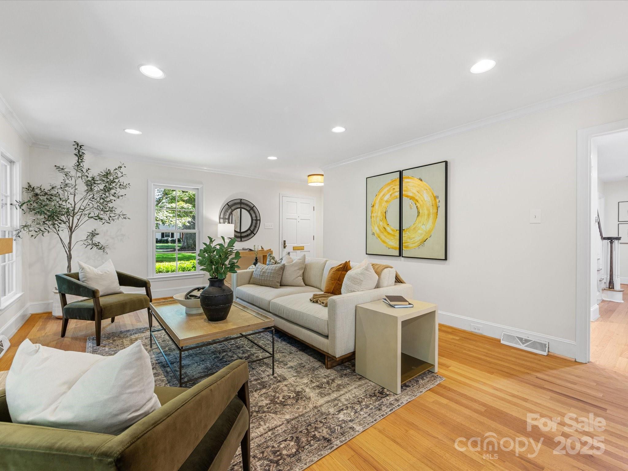 2118 Sharon Road Charlotte, NC 28207 - Photo 6 of 48 a living room with furniture and a potted plant