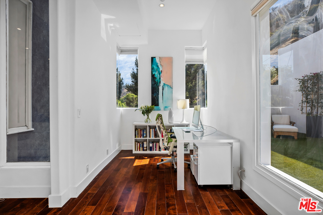 1857 North Beverly Drive Beverly Hills, CA 90210 - Photo 11 of 49 a view of living room with furniture and wooden floor