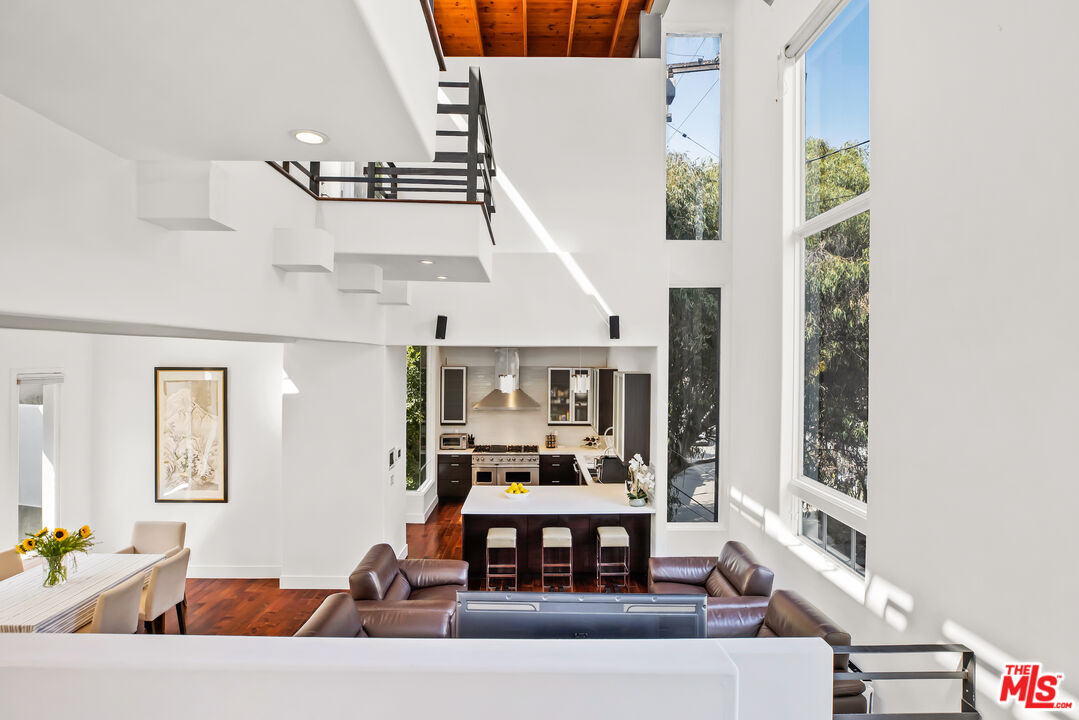 1857 North Beverly Drive Beverly Hills, CA 90210 - Photo 3 of 49 a living room with furniture and a window