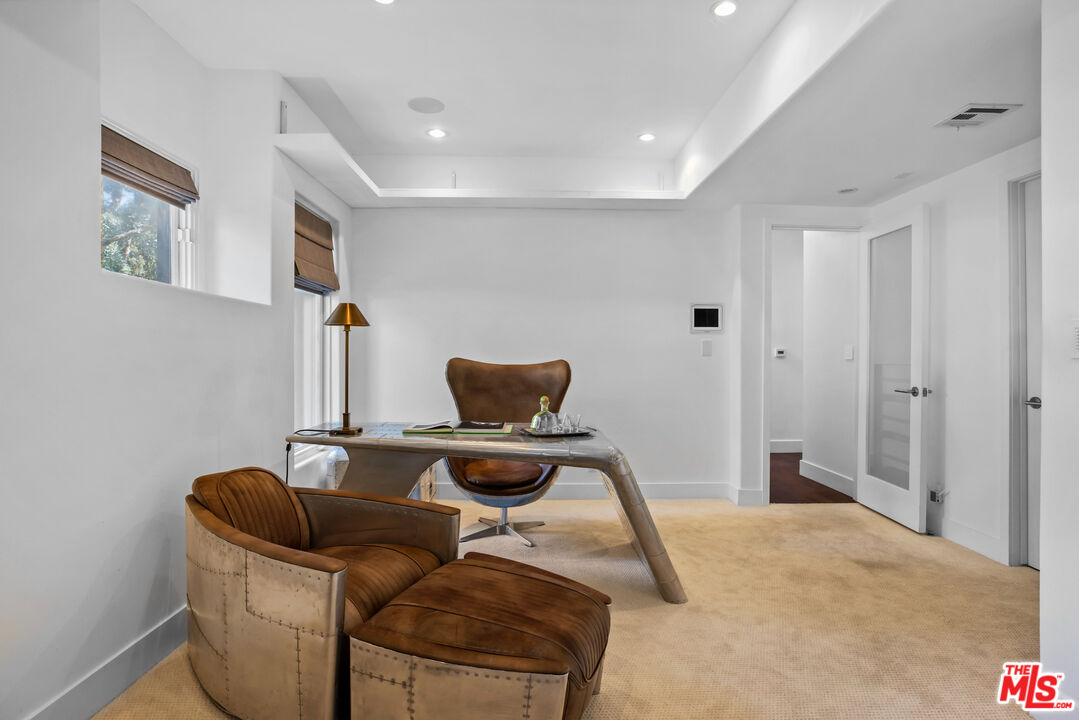 1857 North Beverly Drive Beverly Hills, CA 90210 - Photo 31 of 49 a workspace with furniture and air conditioner