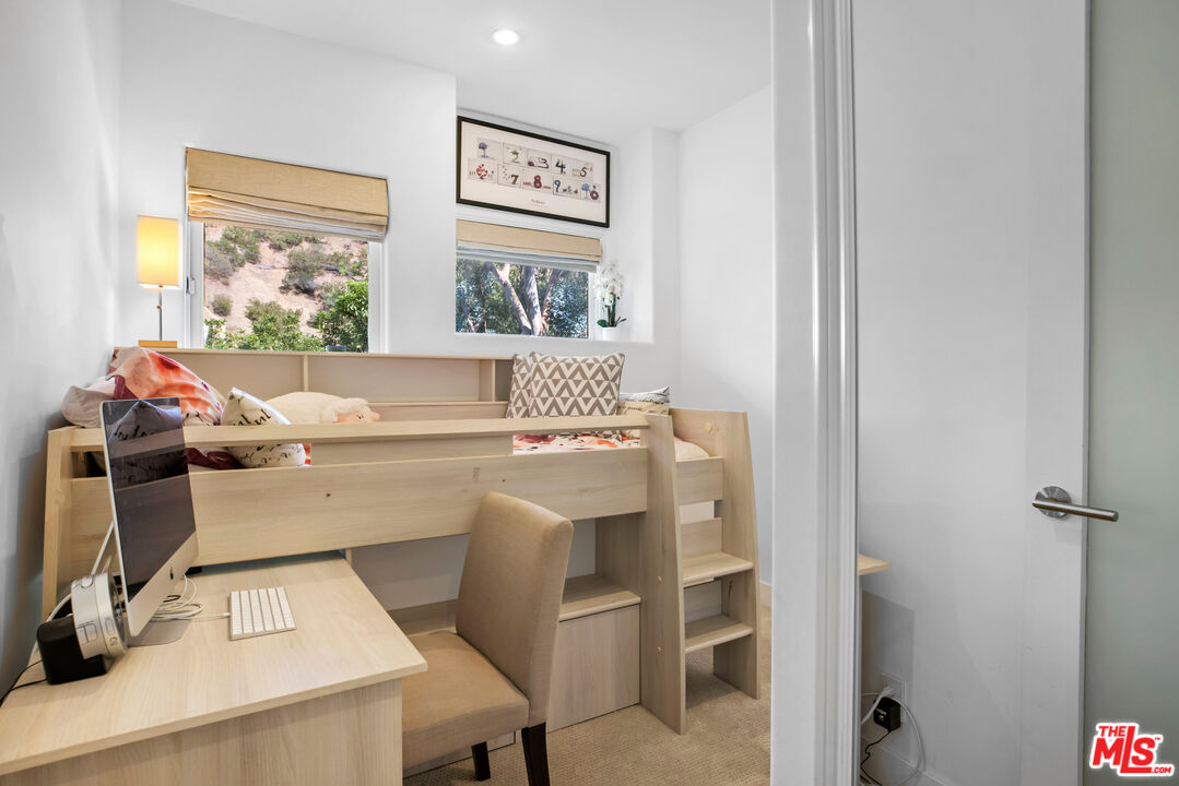 1857 North Beverly Drive Beverly Hills, CA 90210 - Photo 37 of 49 a room with a window and flowerpot