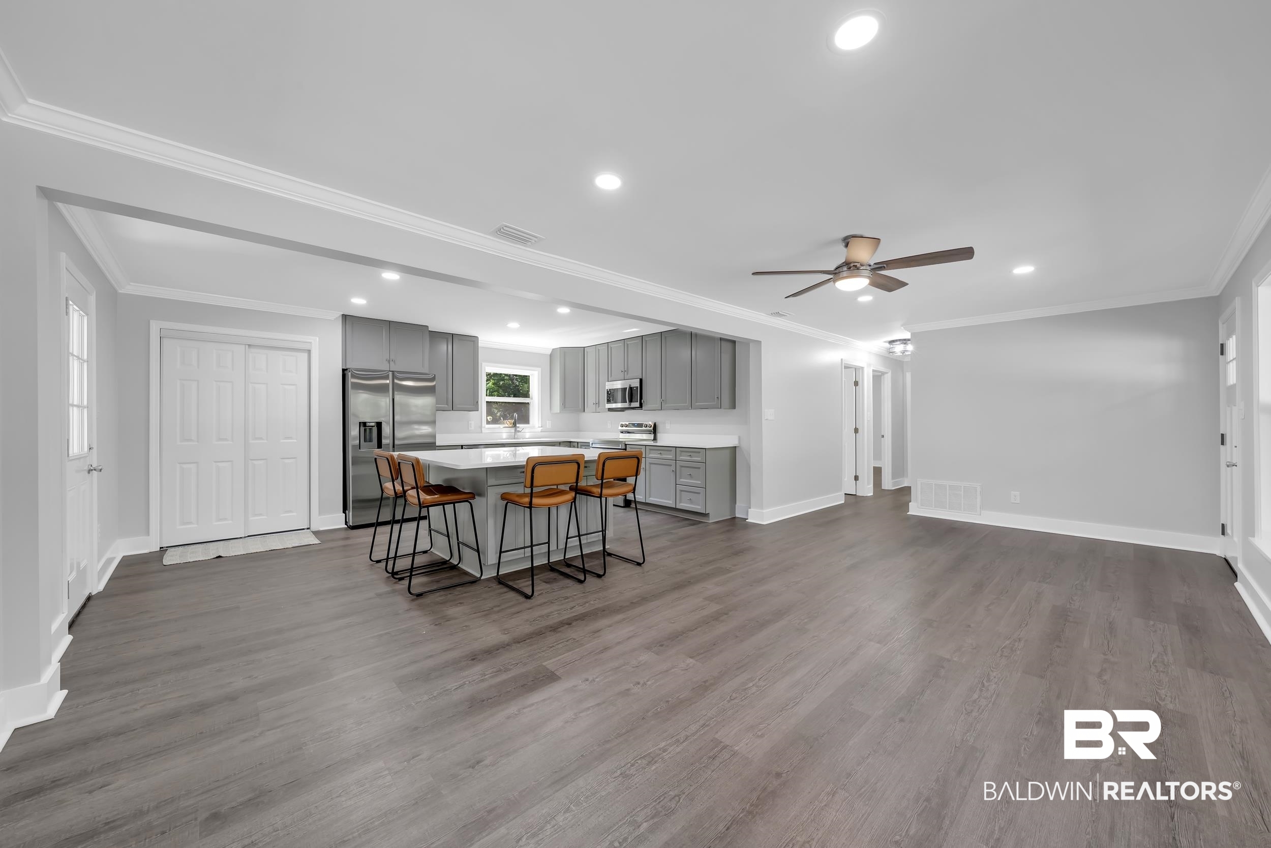 2712 Shelton Beach Rd Extension Mobile, AL 36613 - Photo 7 of 24 Open-concept living area featuring wood-finish flooring, recessed lighting, and a modern ceiling fan