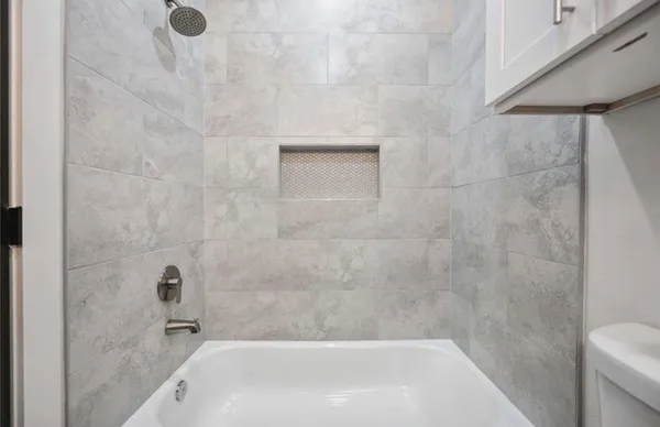 an empty room with a bathroom
