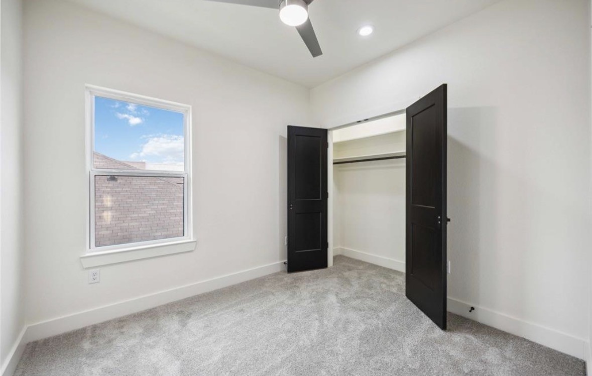7980 Angus Street, Unit A Houston, TX 77028 - Photo 13 of 15 an empty room with windows and closet