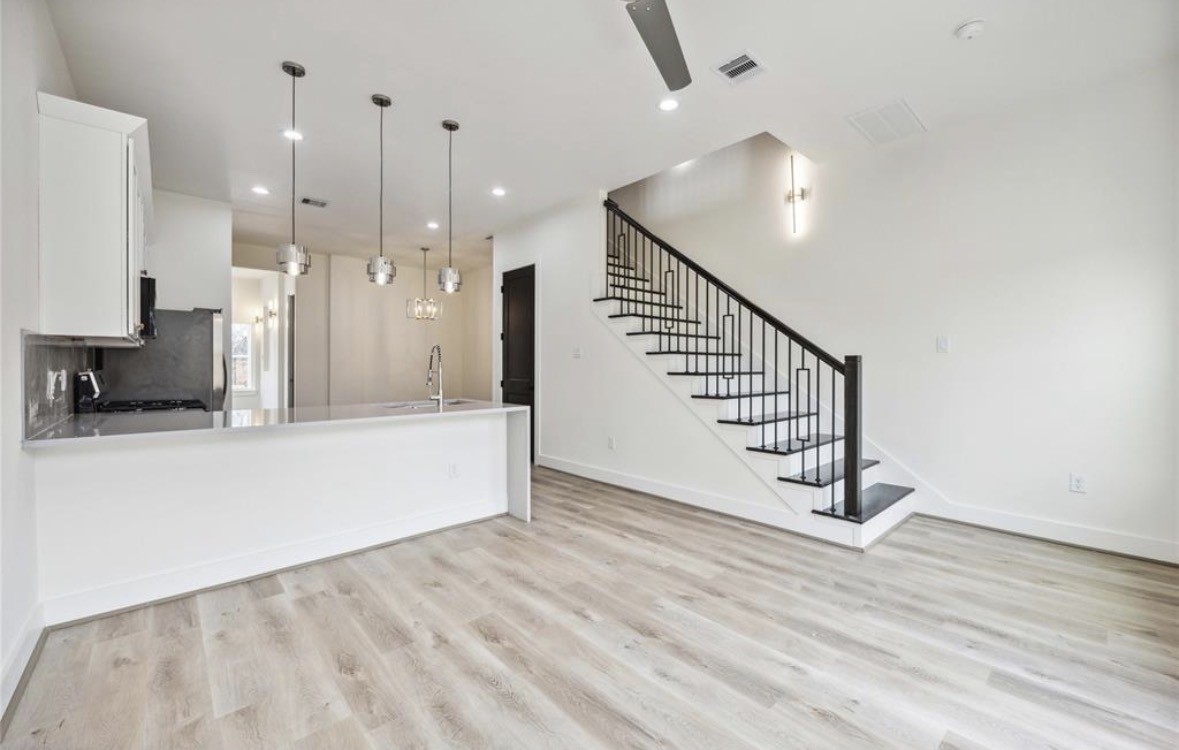 7980 Angus Street, Unit A Houston, TX 77028 - Photo 3 of 15 a view of a room with wooden floor and staircase