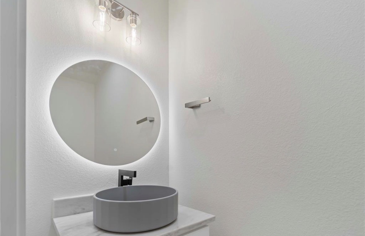 7980 Angus Street, Unit A Houston, TX 77028 - Photo 4 of 15 a bathroom with a sink and mirror