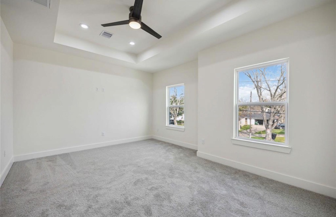7980 Angus Street, Unit A Houston, TX 77028 - Photo 8 of 15 an empty room with windows and fan