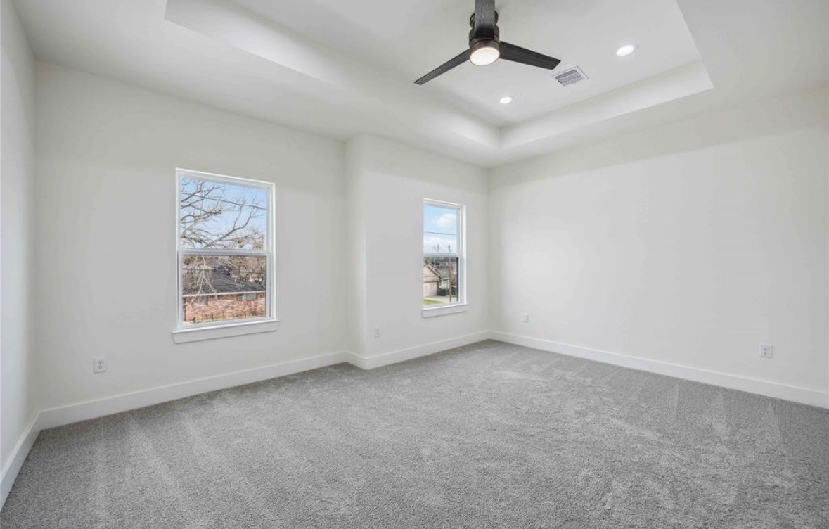 7980 Angus Street, Unit A Houston, TX 77028 - Photo 9 of 15 an empty room with a window and ceiling fan