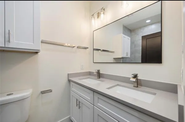 a bathroom with a sink and a toilet