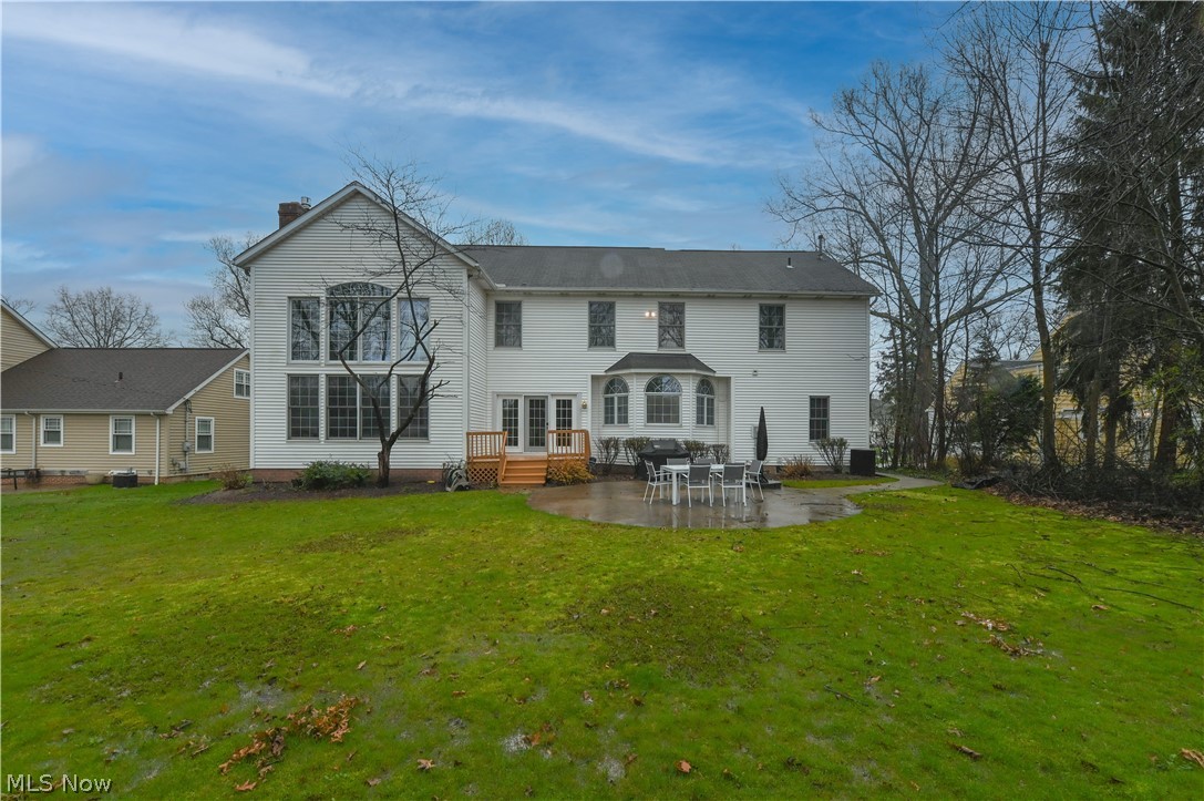1688 Sheridan Road South Euclid, OH 44121 - Photo 47 of 48 Back of property featuring a patio area and a lawn