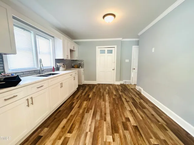 a kitchen with a sink and a window