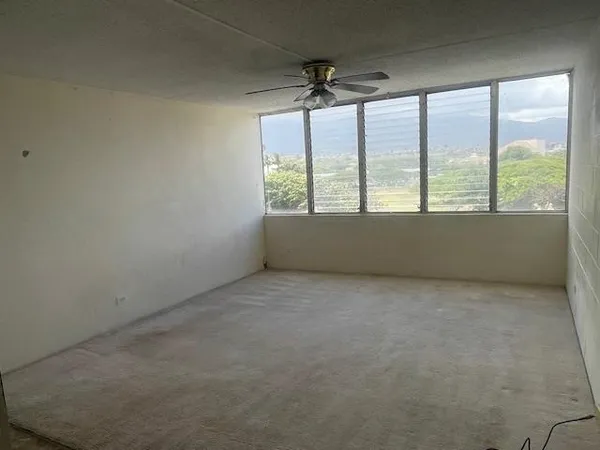 an empty room with a large window