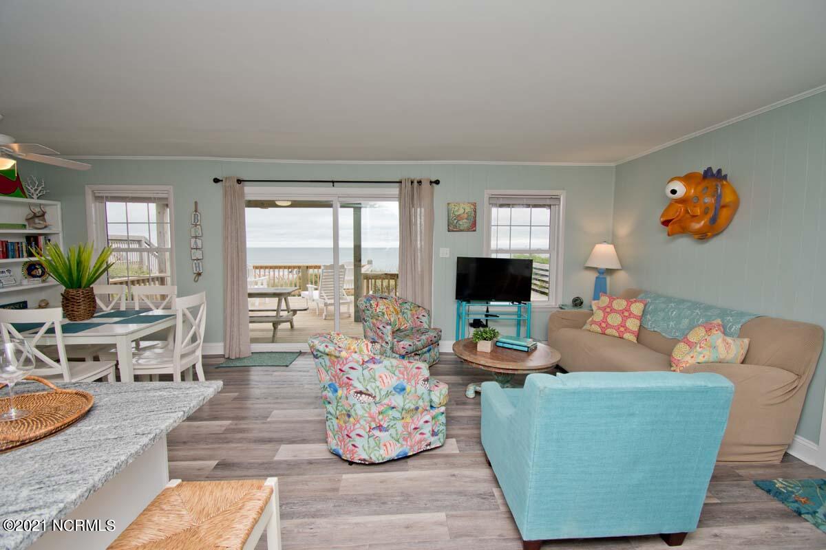 4105 Ocean Drive, Unit E & W Emerald Isle, NC 28594 - Photo 2 of 72 East - Oceanfront views - View 1.This 8 bedroom duplex has undergone many great updates in the last couple of years to include: 2021-EAST SIDE- renovated kitchen with new cabinets, stainless appliances, granite counters, new lvp flooring on first level, and new granite in the lower level bath