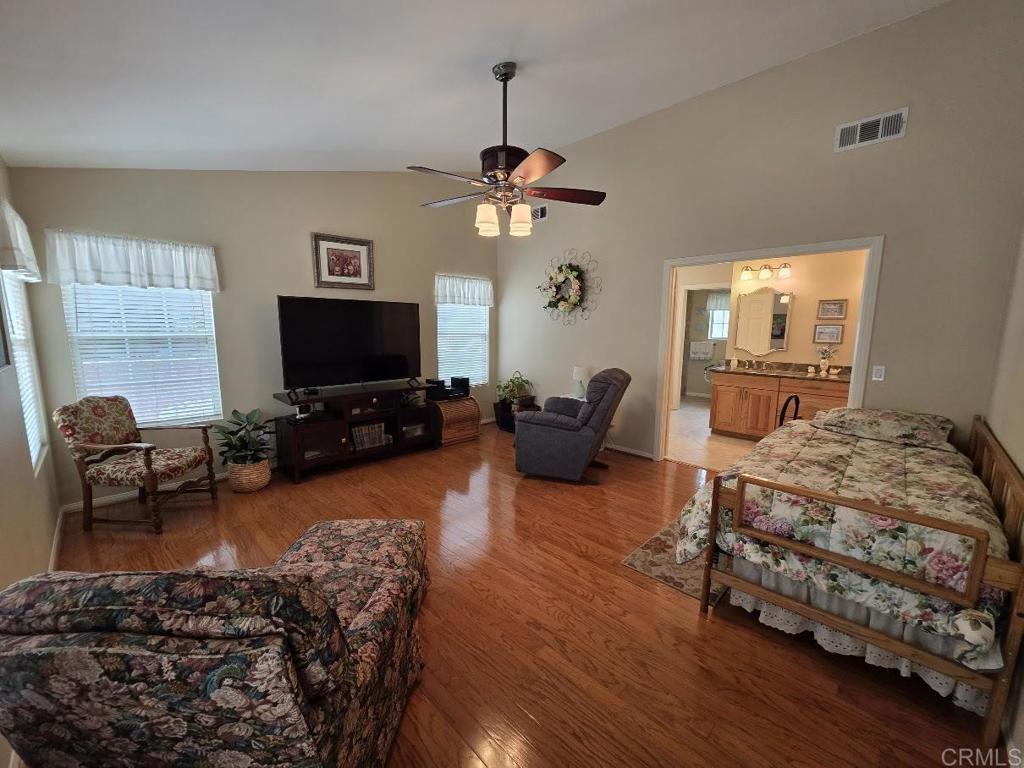 25084 Pappas Road Ramona, CA 92065 - Photo 19 of 58 a living room with furniture a window and a flat screen tv