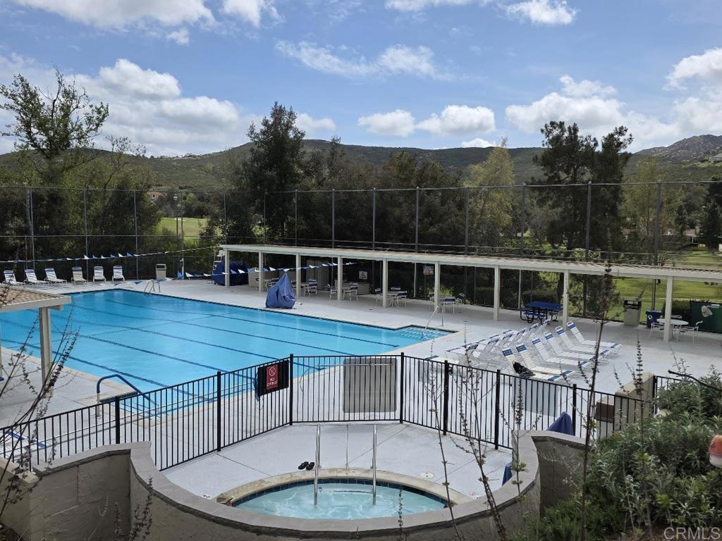25084 Pappas Road Ramona, CA 92065 - Photo 51 of 58 a view of a house with swimming pool and sitting area