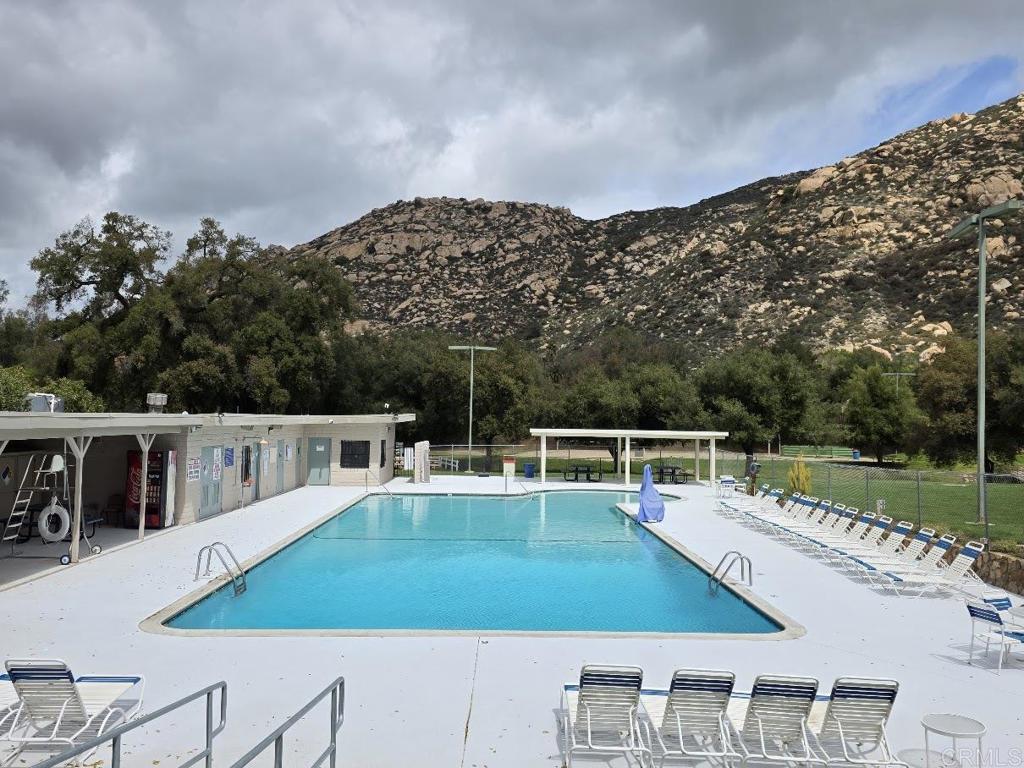 25084 Pappas Road Ramona, CA 92065 - Photo 52 of 58 a view of a swimming pool with a patio