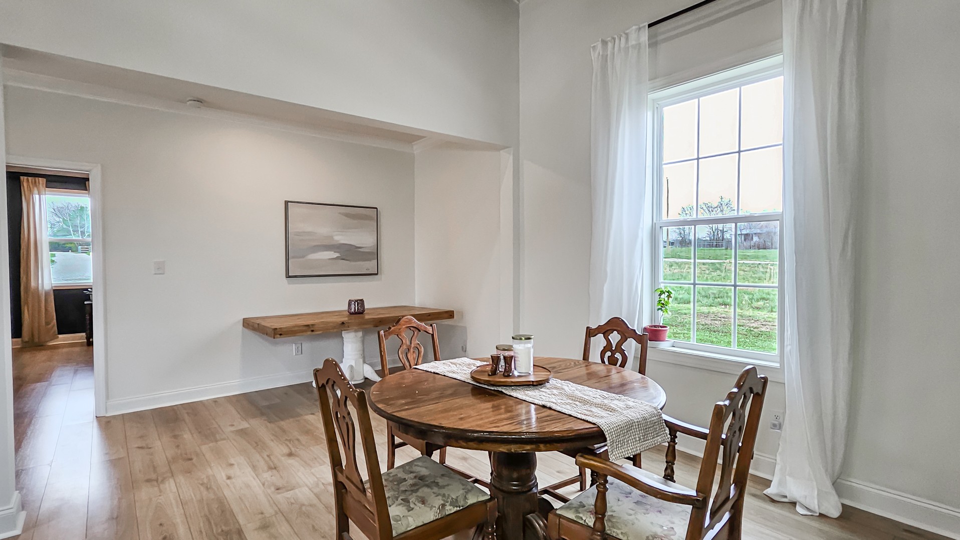25872 Union Hill Road Ardmore, TN 38449 - Photo 11 of 28 a view of a dining room with furniture and wooden floor