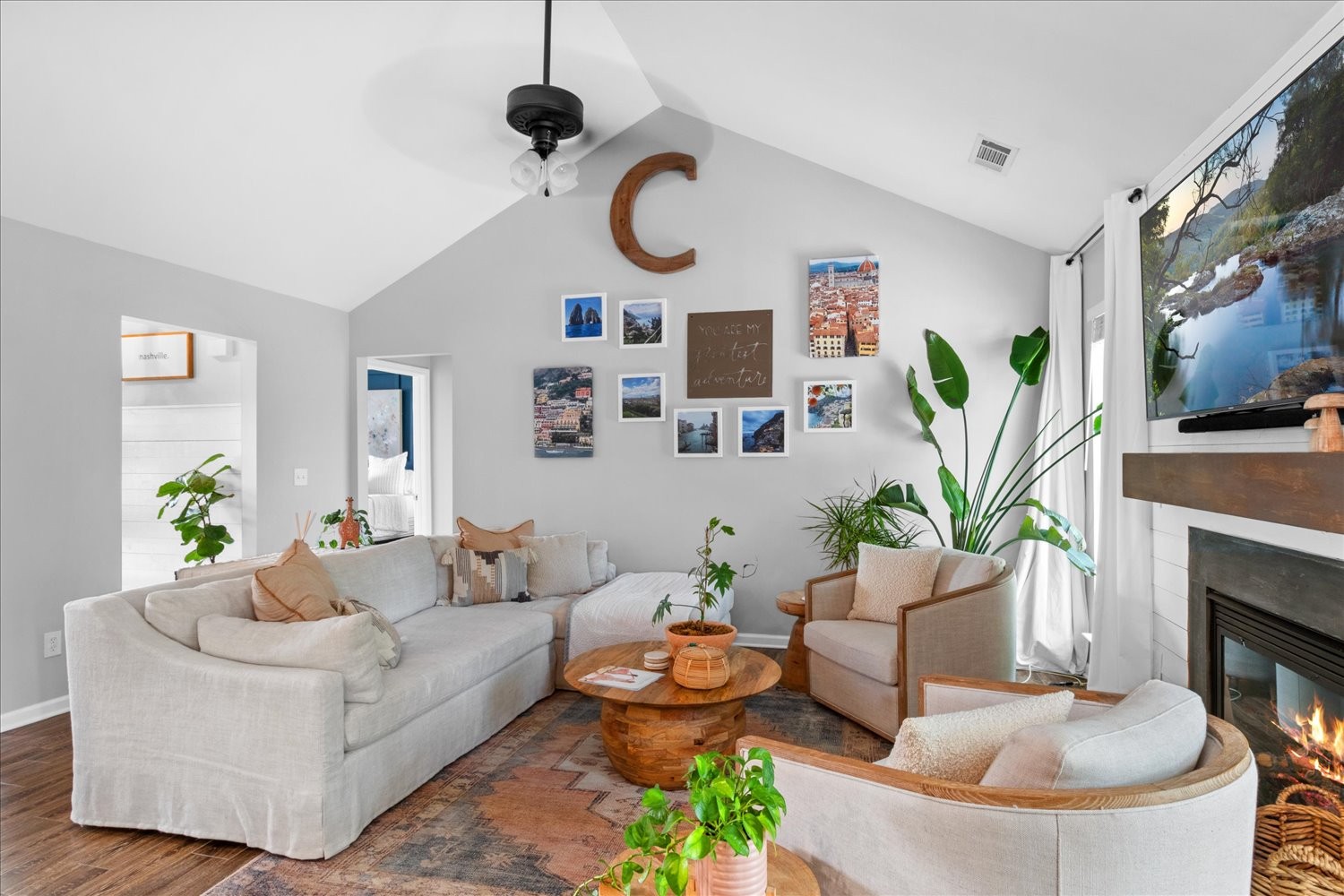 3715 Ivanora Drive Spring Hill, TN 37174 - Photo 11 of 74 a living room with furniture a fireplace and a flat screen tv