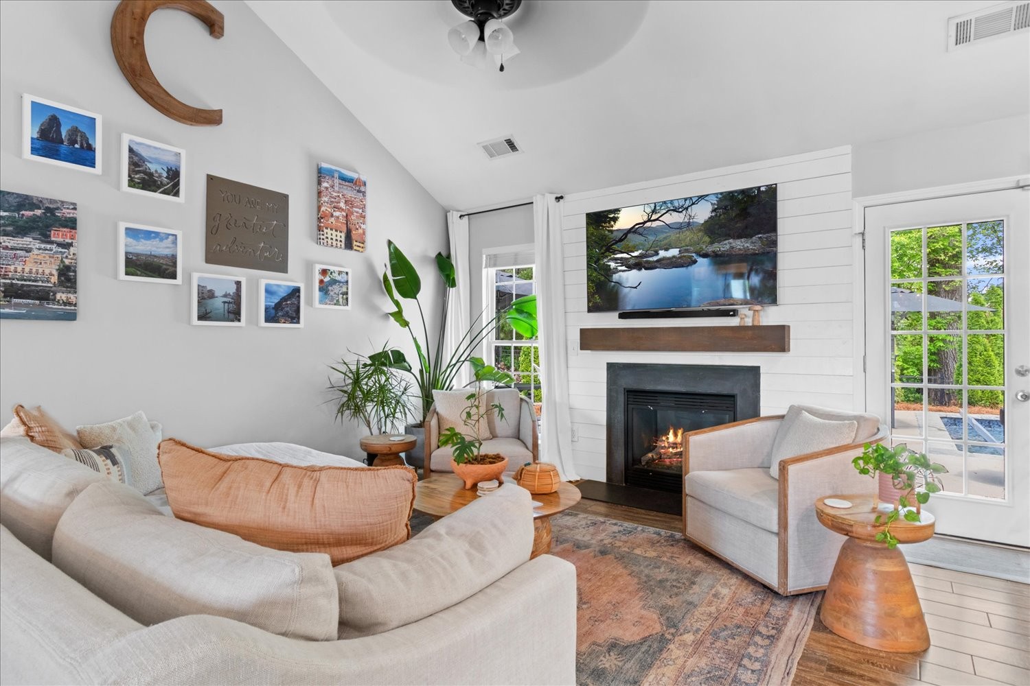 3715 Ivanora Drive Spring Hill, TN 37174 - Photo 12 of 74 a living room with furniture a fireplace and a flat screen tv
