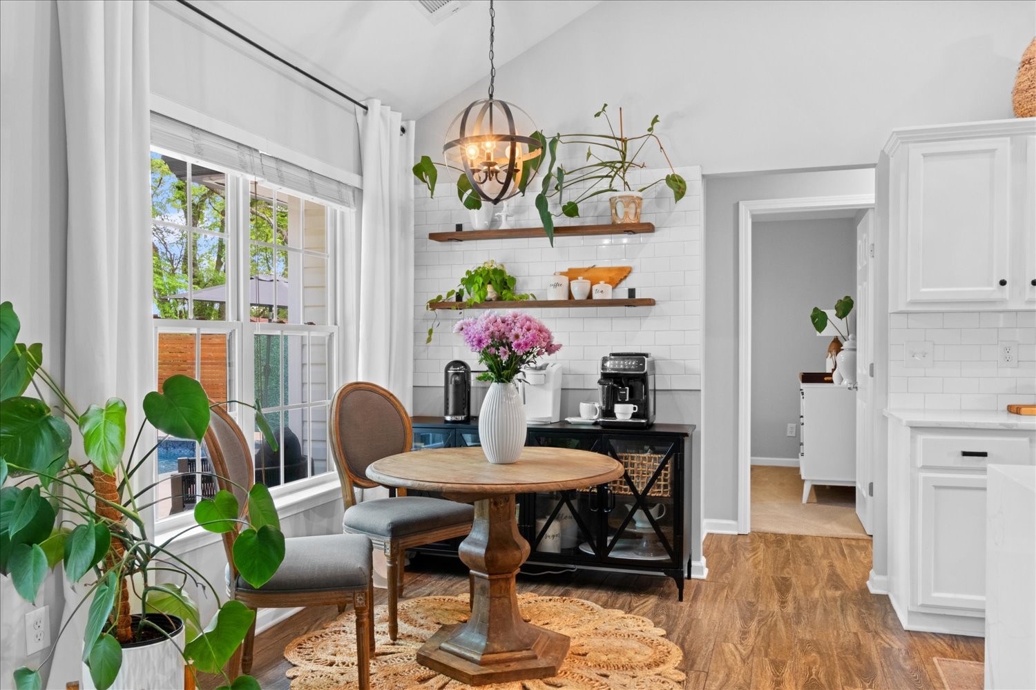 3715 Ivanora Drive Spring Hill, TN 37174 - Photo 18 of 74 a view of a dining room with furniture one side kitchen view and wooden floor