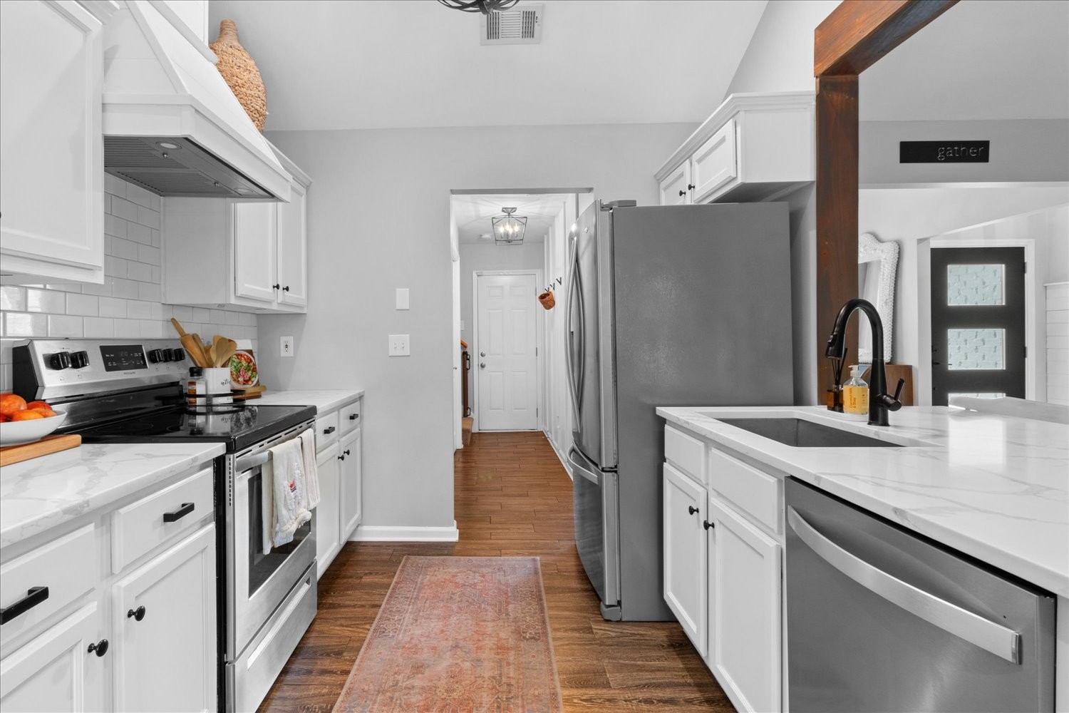 3715 Ivanora Drive Spring Hill, TN 37174 - Photo 20 of 74 a kitchen with a sink and a refrigerator