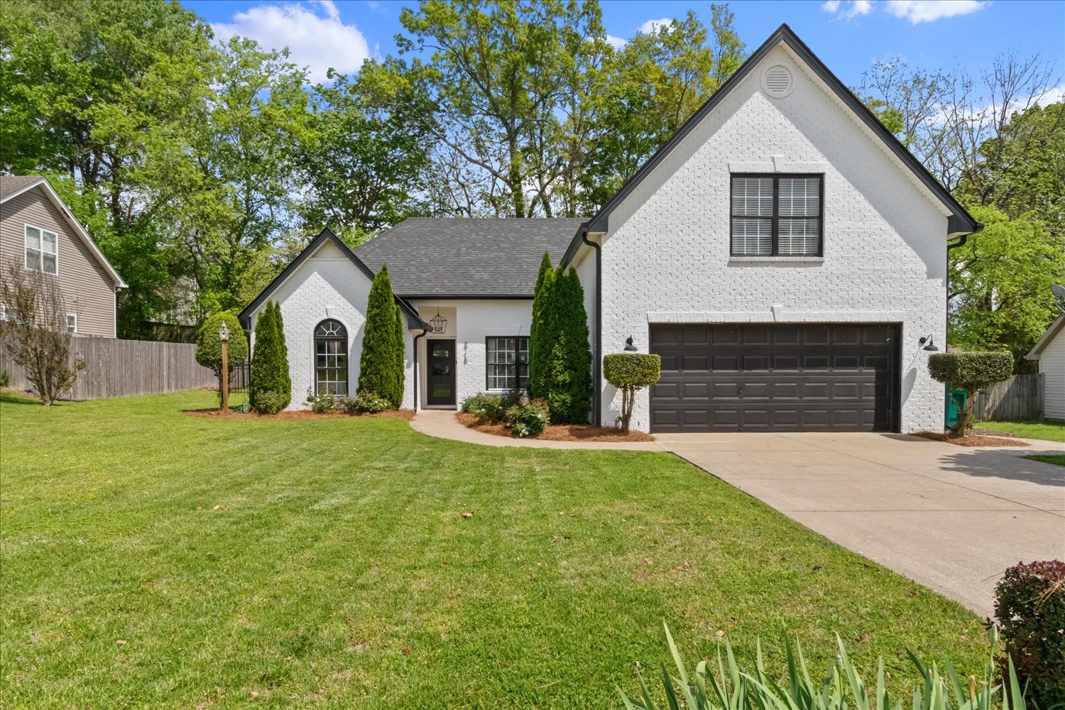 3715 Ivanora Drive Spring Hill, TN 37174 - Photo 2 of 74 a front view of a house with a garden and yard