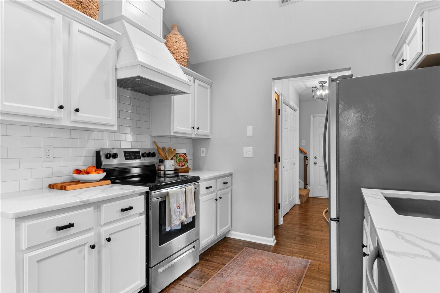 3715 Ivanora Drive Spring Hill, TN 37174 - Photo 21 of 74 a kitchen with stainless steel appliances a white stove top oven and cabinets