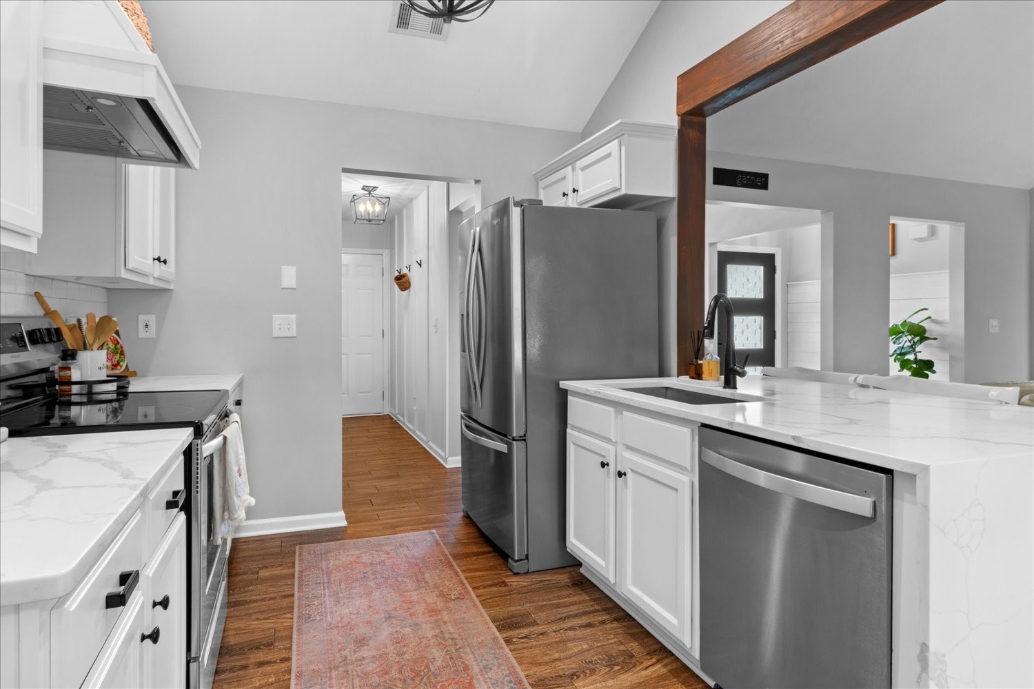 3715 Ivanora Drive Spring Hill, TN 37174 - Photo 22 of 74 a kitchen with a sink and refrigerator