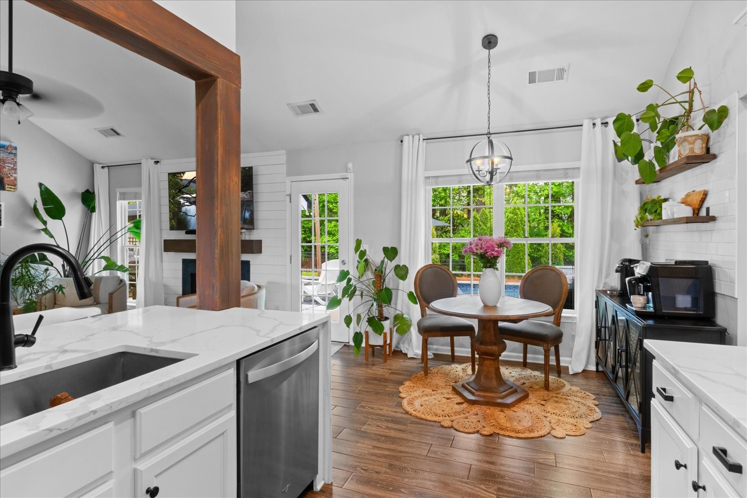 3715 Ivanora Drive Spring Hill, TN 37174 - Photo 24 of 74 a view of a dining room and livingroom with furniture wooden floor a chandelier