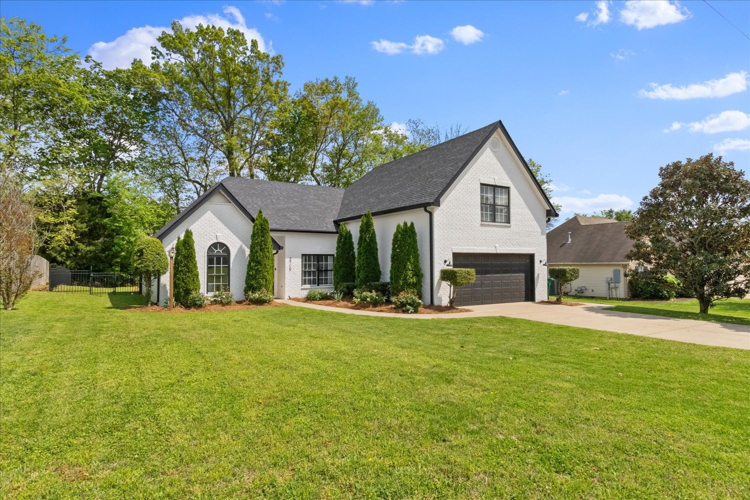3715 Ivanora Drive Spring Hill, TN 37174 - Photo 4 of 74 a front view of a house with a yard and trees
