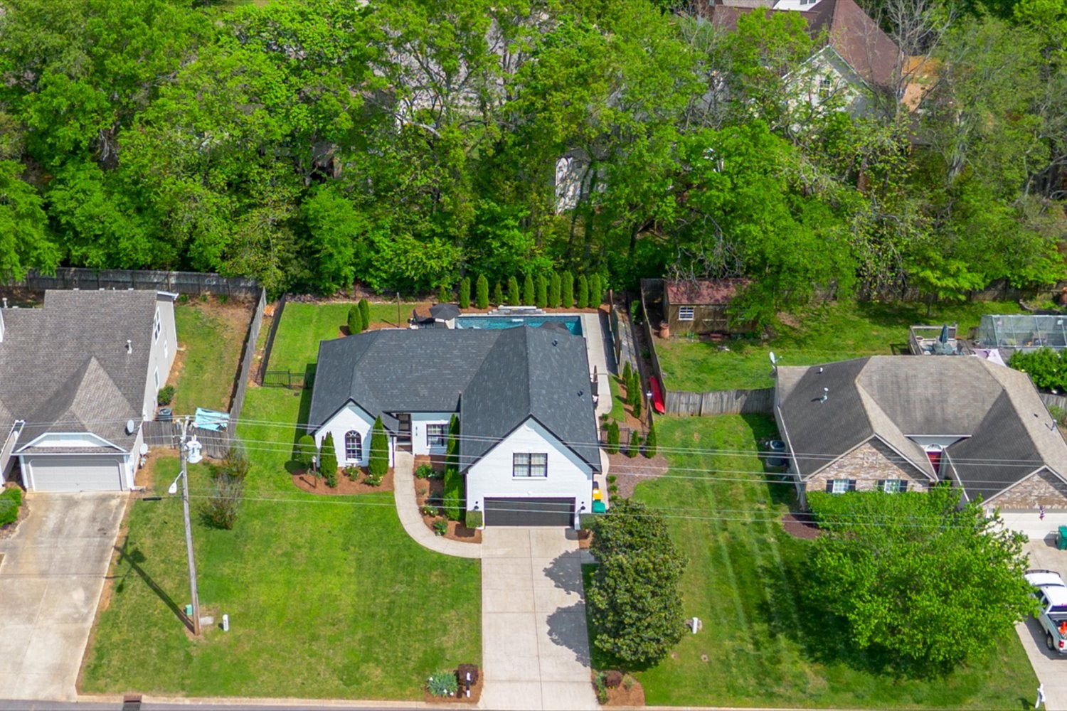 3715 Ivanora Drive Spring Hill, TN 37174 - Photo 51 of 74 an aerial view of a house with swimming pool and garden