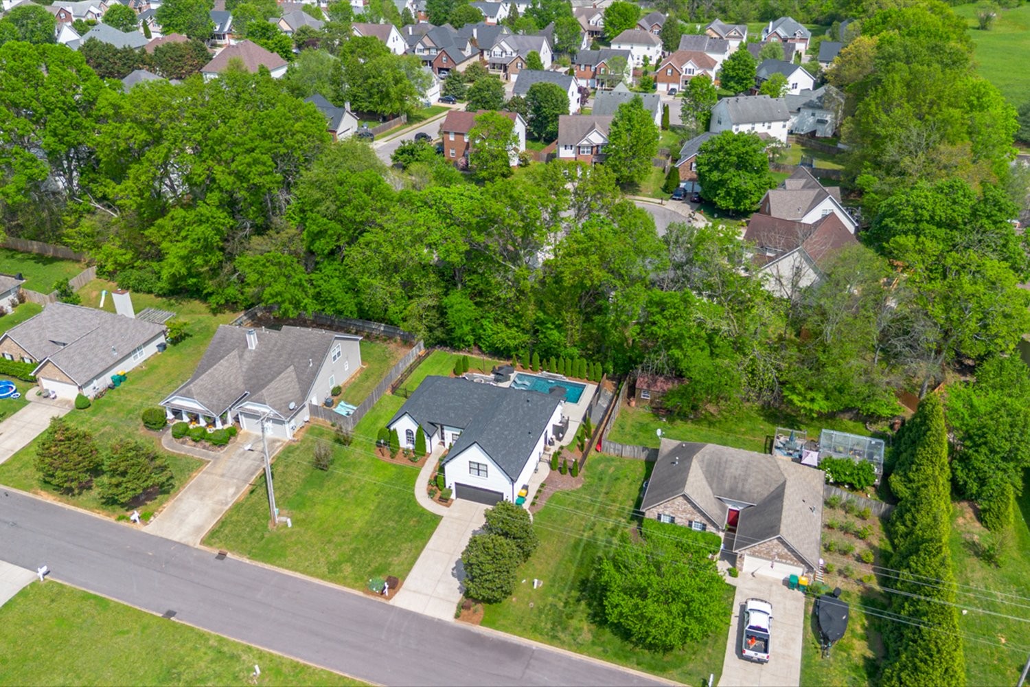 3715 Ivanora Drive Spring Hill, TN 37174 - Photo 58 of 74 an aerial view of a house with a yard basket ball court and outdoor seating