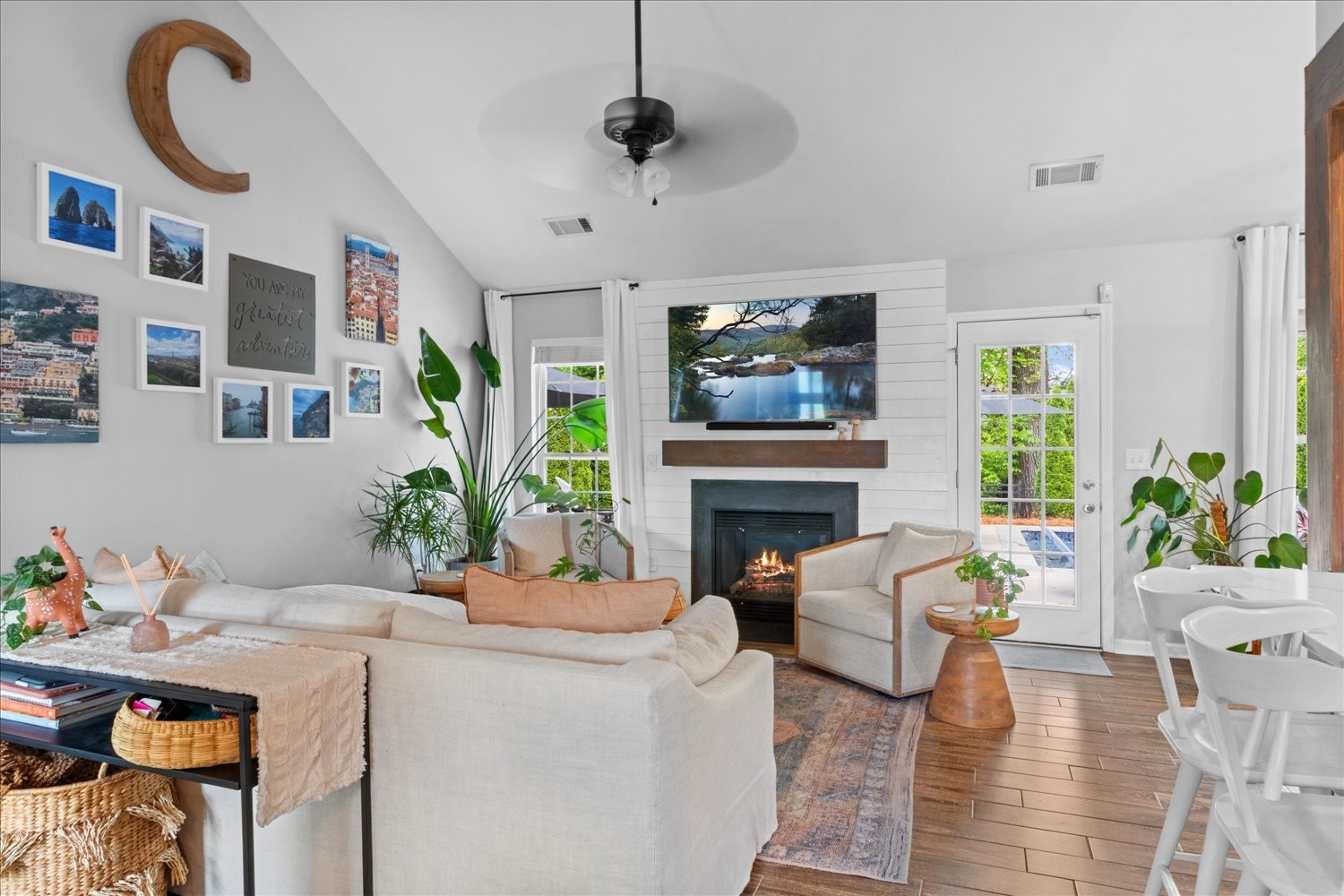 3715 Ivanora Drive Spring Hill, TN 37174 - Photo 9 of 74 a living room with furniture a flat screen tv and a fireplace