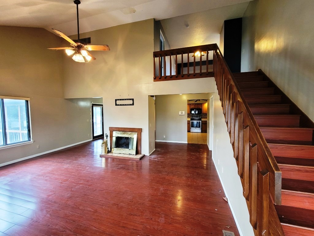 2601 Rachel Road Champaign, IL 61822 - Photo 5 of 22 a view of a livingroom with wooden floor and a fireplace