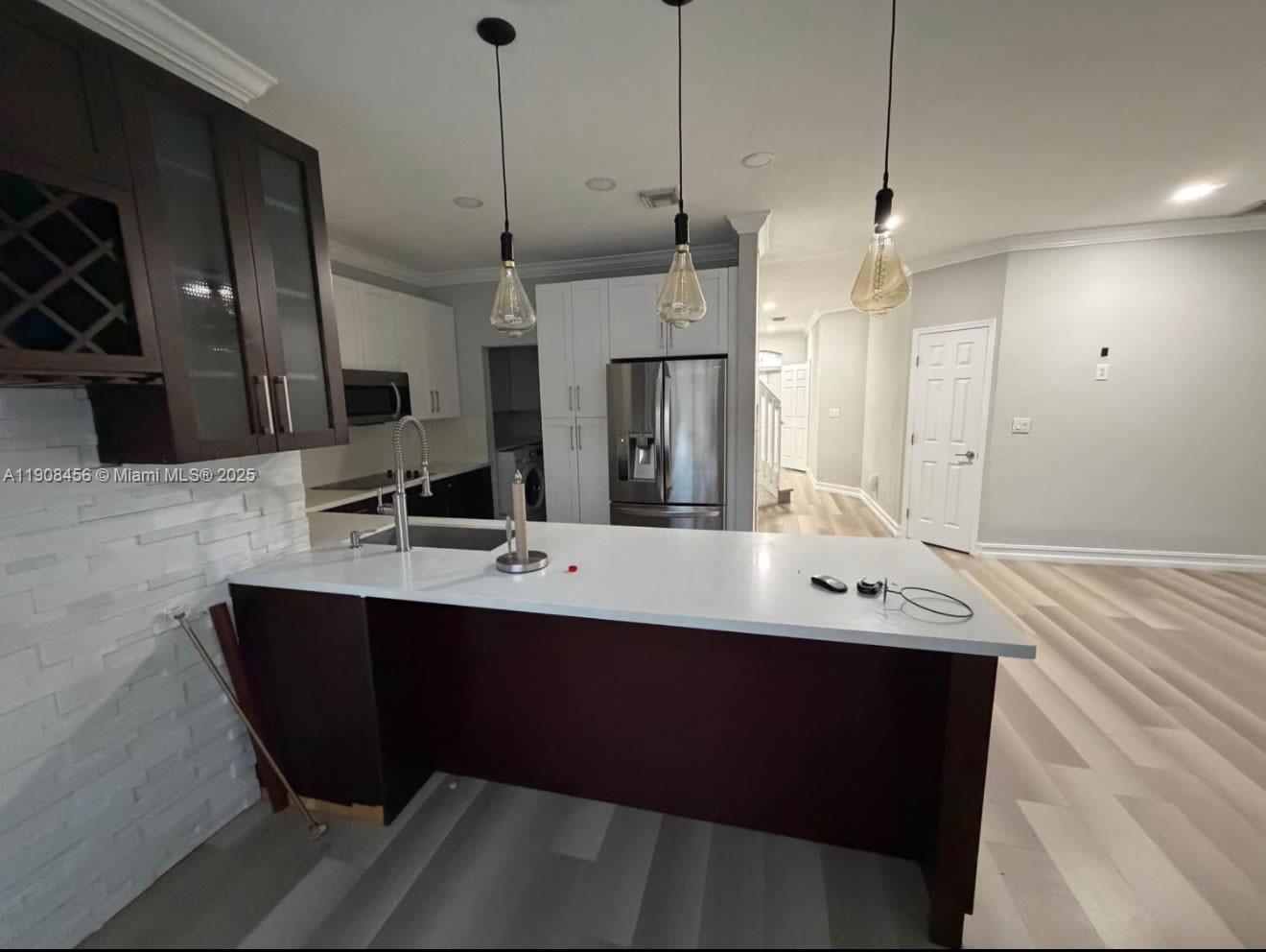 965 Southwest 153rd Path Miami, FL 33194 - Photo 14 of 27 a bathroom with a sink double vanity and a mirror