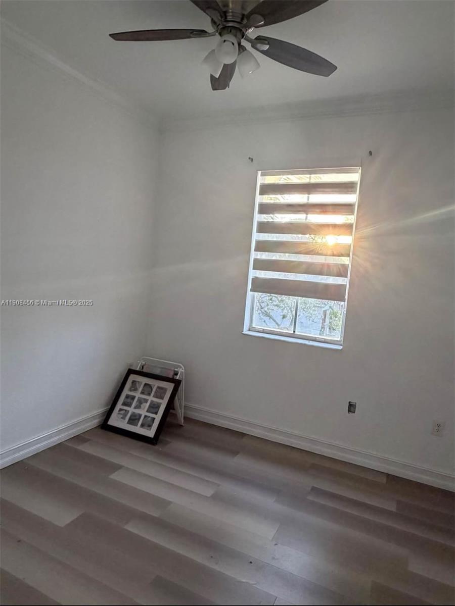 965 Southwest 153rd Path Miami, FL 33194 - Photo 15 of 27 a view of room with window and wooden floor
