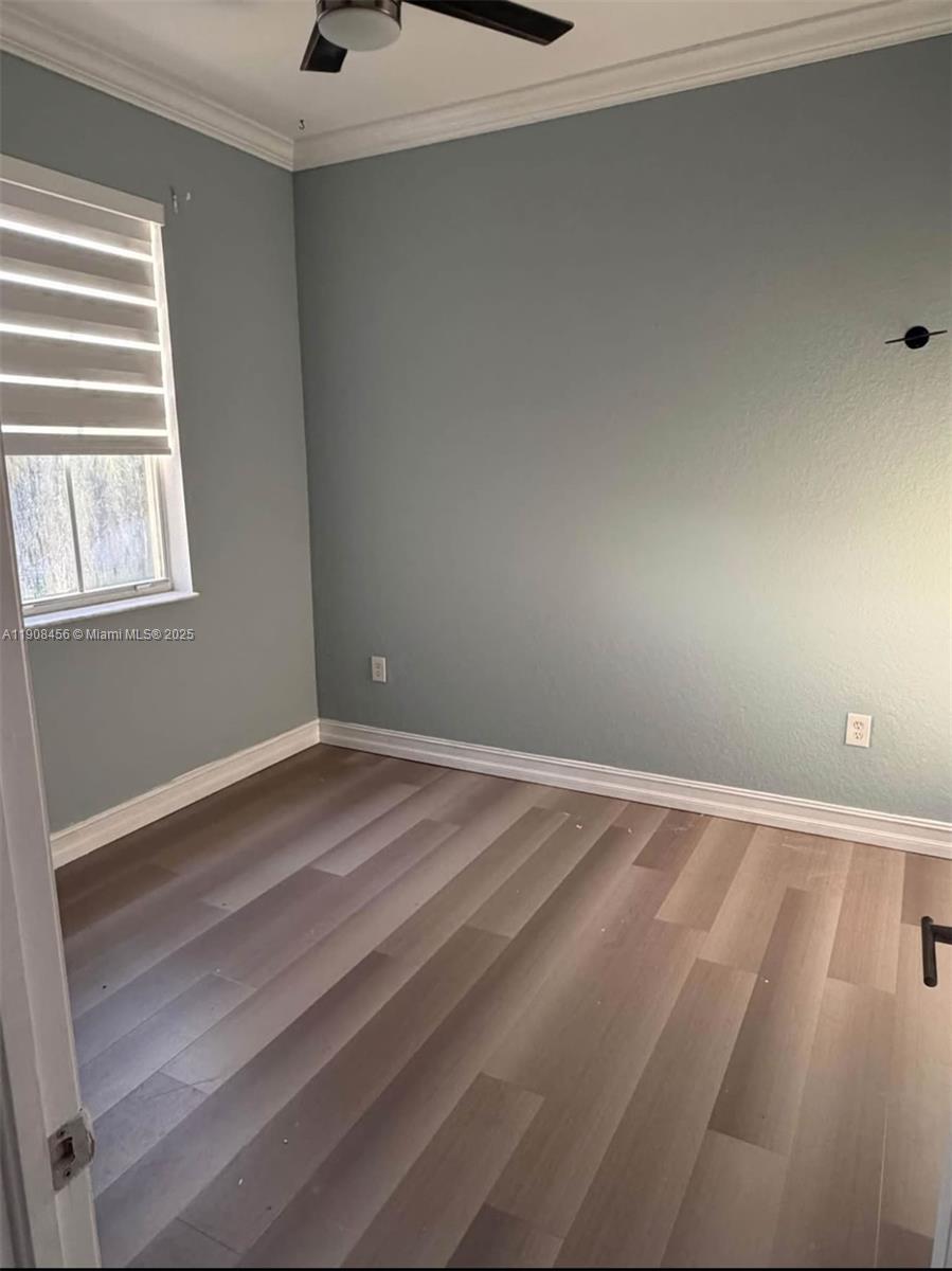 965 Southwest 153rd Path Miami, FL 33194 - Photo 16 of 27 a view of an empty room with a window