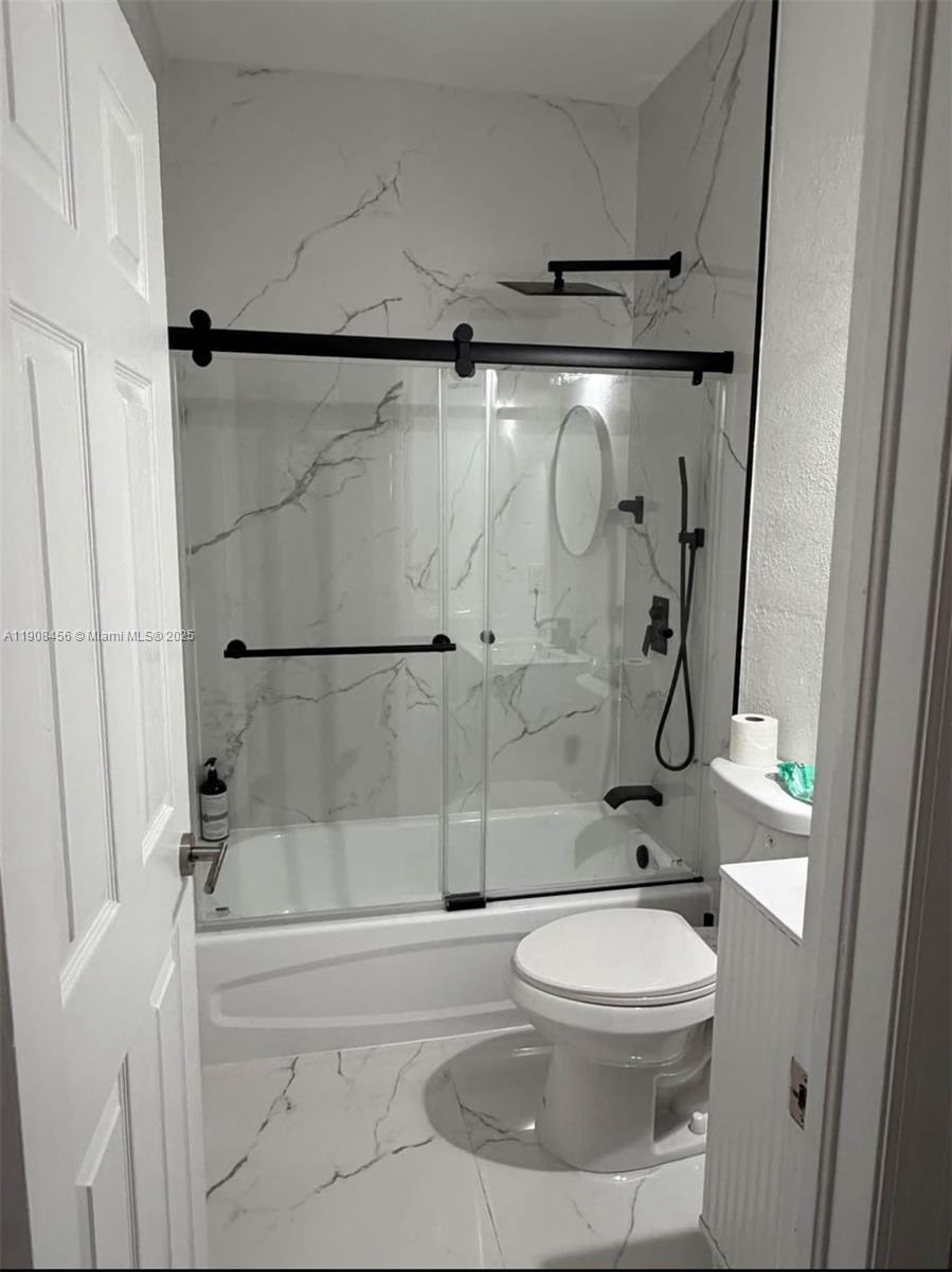 965 Southwest 153rd Path Miami, FL 33194 - Photo 17 of 27 a bathroom with a toilet and a shower