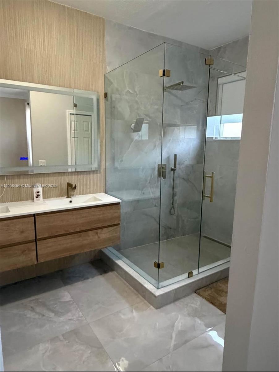 965 Southwest 153rd Path Miami, FL 33194 - Photo 19 of 27 a bathroom with a bathtub and shower