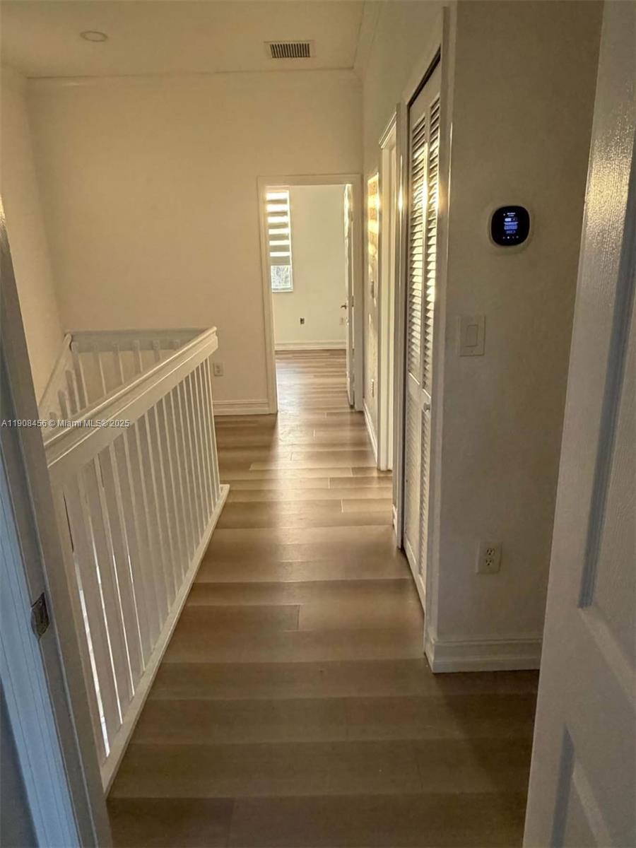 965 Southwest 153rd Path Miami, FL 33194 - Photo 27 of 27 a view of a hallway with wooden floor and staircase