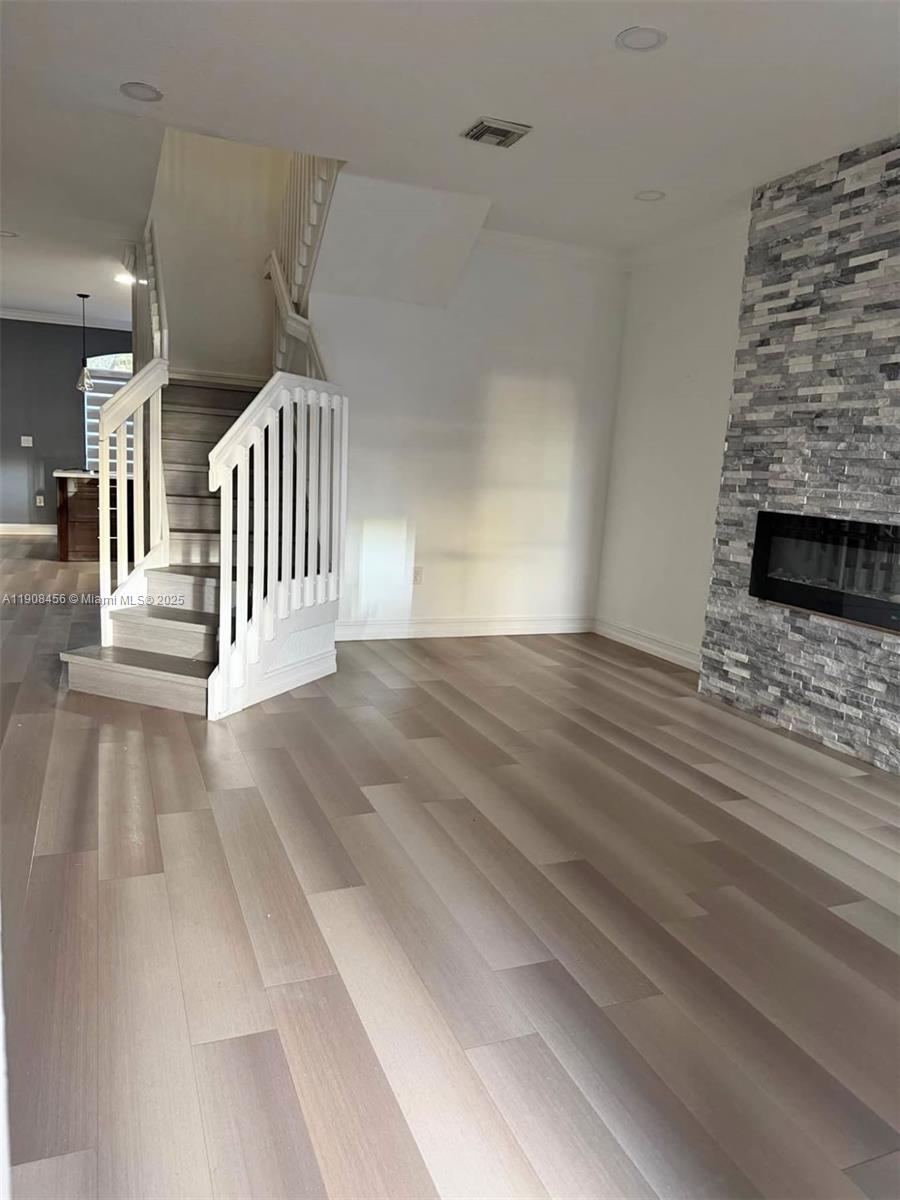 965 Southwest 153rd Path Miami, FL 33194 - Photo 3 of 27 wooden floor in a hall with a fireplace